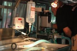 A fully equipped examination table with Oxi-meter, IV pump and Gas-anesthetics machine in the Van