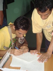 one of the arrested men signing the confession