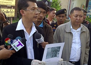 Officials show the photograph of the suspect from a CCTV camera