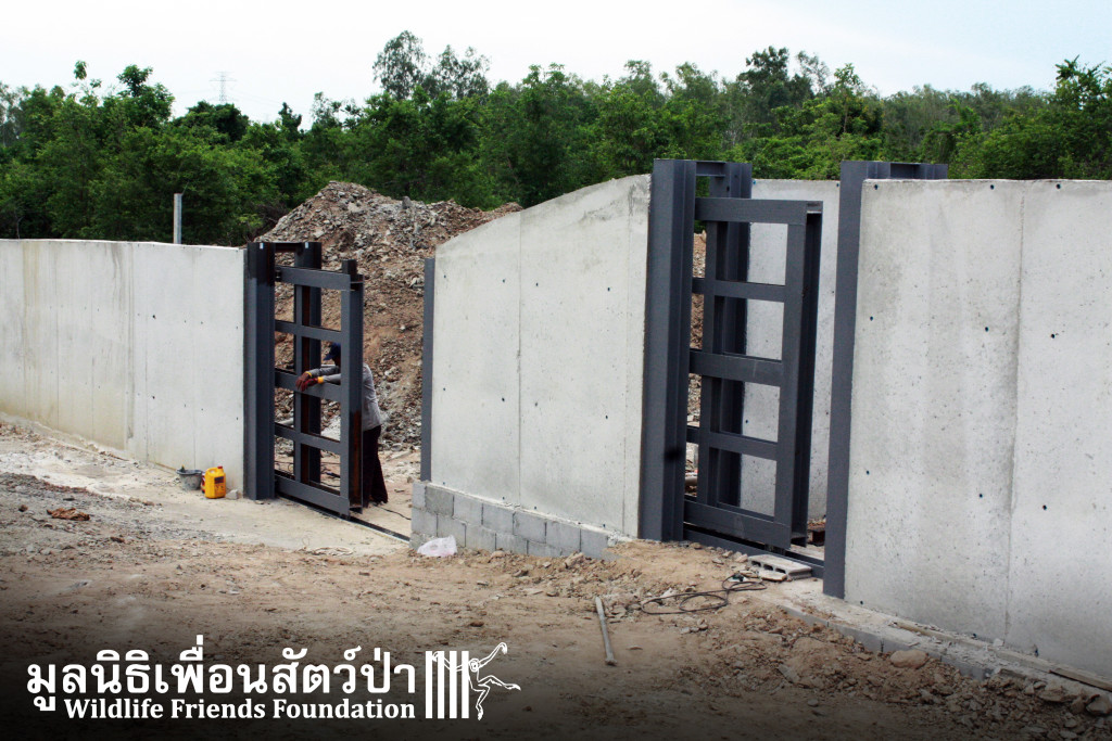 Two massive steel doors, one as main entrance, the other to enter the side enclosure.
